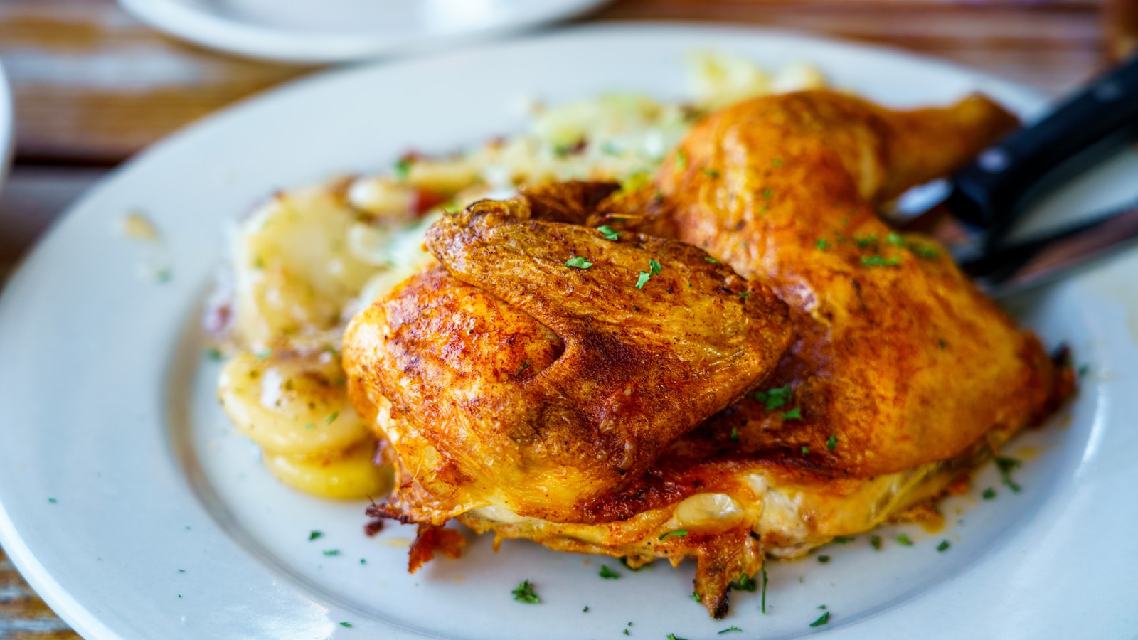 greek chicken food on white ceramic plate